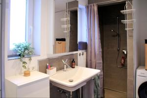 a bathroom with a sink and a shower at Villa Kolck in Xanten +36 photos