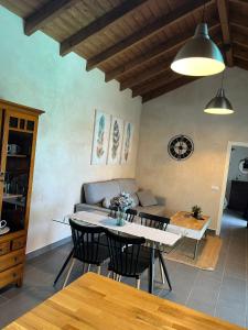 a living room with a table and a couch at Seaside Villa in El Roque (El Cotillo) with Private Pool in Cotillo