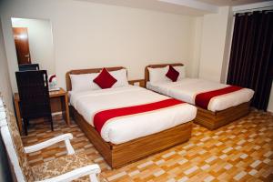 Postel nebo postele na pokoji v ubytování pashupati front hotel