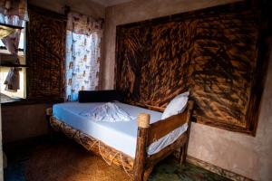 Postel nebo postele na pokoji v ubytování Langalanga Eco Farm