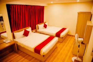 Postel nebo postele na pokoji v ubytování pashupati front hotel