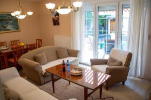 a living room with a couch and a table at Apartment Stella in Bihać