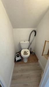 a bathroom with a toilet in a small room at L’appartement du Micocoulier in Salon-de-Provence +14 photos
