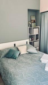 a bedroom with a bed with two pillows on it at Civico 18 Guest House in Cuneo