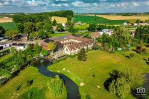 an aerial view of a mansion with a river at Country Lodge Hotel Moriaanshoofd in Oudenaarde