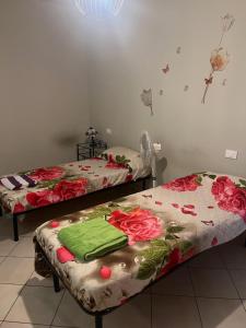 Postel nebo postele na pokoji v ubytování CASA ORCHIDEA LITTA