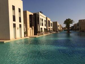 a pool of water in the middle of a building at elgouna scarab es first floor in El Gouna