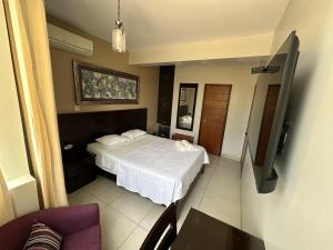 TV a/nebo společenská místnost v ubytování Cacique Hotel