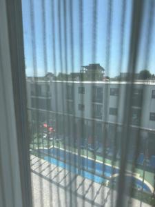 a view from a window of a balcony with a pool at Hotel Mondial - Eforie Nord in Eforie Nord