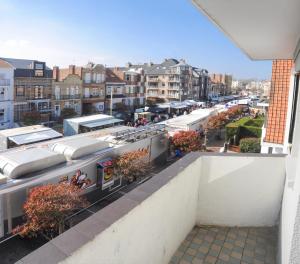 a view of a city from the balcony of a building at Logies Het Maantje in De Panne