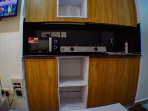 a microwave sitting on top of a kitchen counter at Cozy Homes in Nairobi