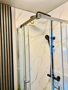 a shower in a bathroom with a glass door at East Bridgford Summerhouse Inc Spa and Treatments in East Bridgford +60 photos