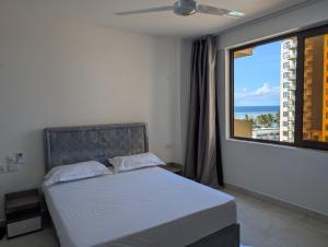 Afbeelding uit fotogalerij van Seaside Serenity at Sandy Shore in Kikambala +7 foto's