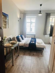 Posteľ alebo postele v izbe v ubytovaní Property Apart - Ruska Centrum