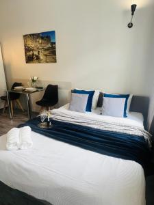 Posteľ alebo postele v izbe v ubytovaní Property Apart - Ruska Centrum