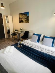 Posteľ alebo postele v izbe v ubytovaní Property Apart - Ruska Centrum