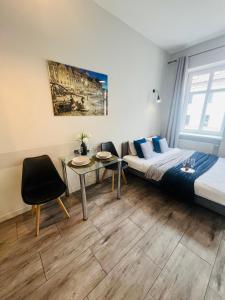 Posteľ alebo postele v izbe v ubytovaní Property Apart - Ruska Centrum