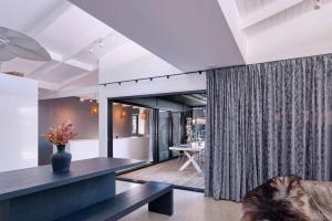 a living room with a couch and a table at Desert Flame - Couples Retreat near the Beach in Marcus Beach