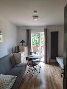 a living room with a couch and a table at Pokoje gościnne Keja in Wisełka
