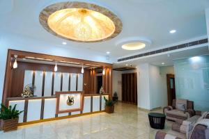 a large lobby with a large ceiling at PUTHUR RESIDENCY HOTELS PVT LTD in Trichūr
