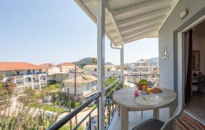 a balcony with a table and a view at Amara Sea View - Luxury Living Lefkada in Nydri