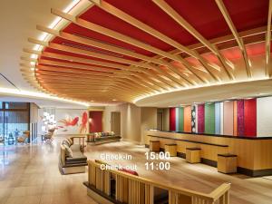 a lobby of a hotel with a colorful ceiling at Mitsui Garden Hotel Kyoto Shijo in Kyoto
