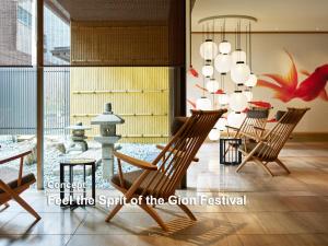 a room with a group of chairs and a chandelier at Mitsui Garden Hotel Kyoto Shijo in Kyoto
