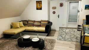 a living room with a couch and a coffee table at La Régence Ch 2 in Brette-les-Pins
