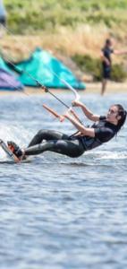 a woman in the water holding onto a kite at Casa di SaleRosa in Rilievo
