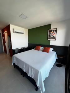 Postel nebo postele na pokoji v ubytování Studio moderno com Rooftop