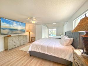 a bedroom with a bed and a large window at Siesta Key Paradise, Vacation Pool Home, Near Beach, Restaurants and More in Sarasota +25 photos