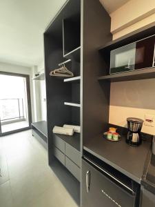 Kuchyň nebo kuchyňský kout v ubytování Studio moderno com Rooftop