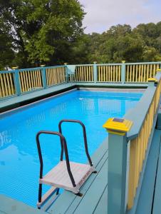 a chair sitting next to a swimming pool at Serenity Now Sunset Beach in Sunset Beach