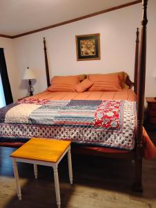 a bedroom with a bed with a wooden frame at Serenity Now Sunset Beach in Sunset Beach