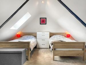 Voodi või voodid majutusasutuse Kerrim Cottage toas +11 fotot