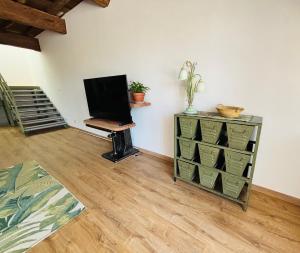 TV a/nebo společenská místnost v ubytování L'Atelier des Rêves