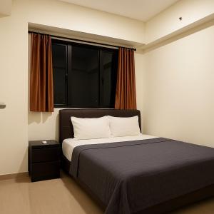 Ένα ή περισσότερα κρεβάτια σε δωμάτιο στο Apartemen Meikarta Cikarang by Cheapinn