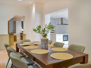 a dining room with a wooden table and chairs at The Parade - Uk48433 in Bridlington