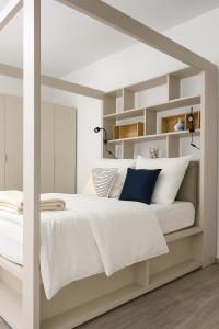 a bedroom with a white bed with white pillows at Letnisko, cisza, spokój , blisko morza Górsko 15 in Górsko