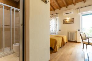 Ένα ή περισσότερα κρεβάτια σε δωμάτιο στο Boutique Hotel Scalzi - Adults Only