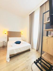 Postel nebo postele na pokoji v ubytování Drooms