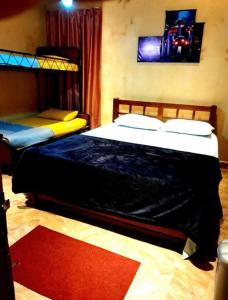 a bedroom with two bunk beds and a red rug at B City Villa Ella in Ella