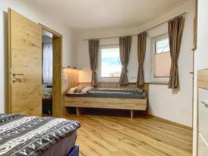 Una cama o camas en una habitación de 11er Kogel