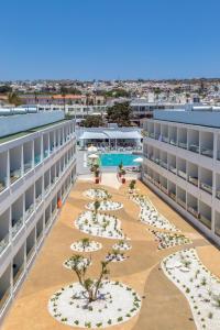 an aerial view of the courtyard of an apartment building at Nicholas Color Hotel in Ayia Napa