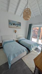 Кровать или кровати в номере Villa PermaVista in Alleinlage und mit Infinity-Pool auf der Sonnenseite +40 фотографий