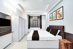 Ένα ή περισσότερα κρεβάτια σε δωμάτιο στο Hotel O Good Living Laxmi Nagar