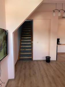 a staircase in a room with a stair case at Panorama Studio Sighisoara in Sighişoara