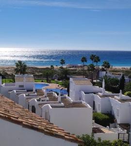 a view of the ocean from the balcony of a resort at Adosado tres habitaciones, en Bahía de la Plata, Zahara de los atunes in Zahara de los Atunes