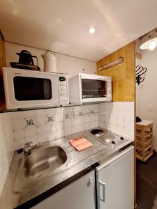 Η κουζίνα ή μικρή κουζίνα στο Studio in Front De Neige Charvet Arc 1800