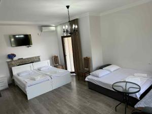 Letto o letti in una camera di Lia Guest House